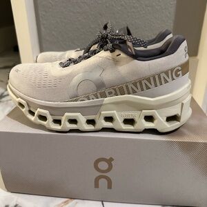 On Running Cream and Gray Sneakers